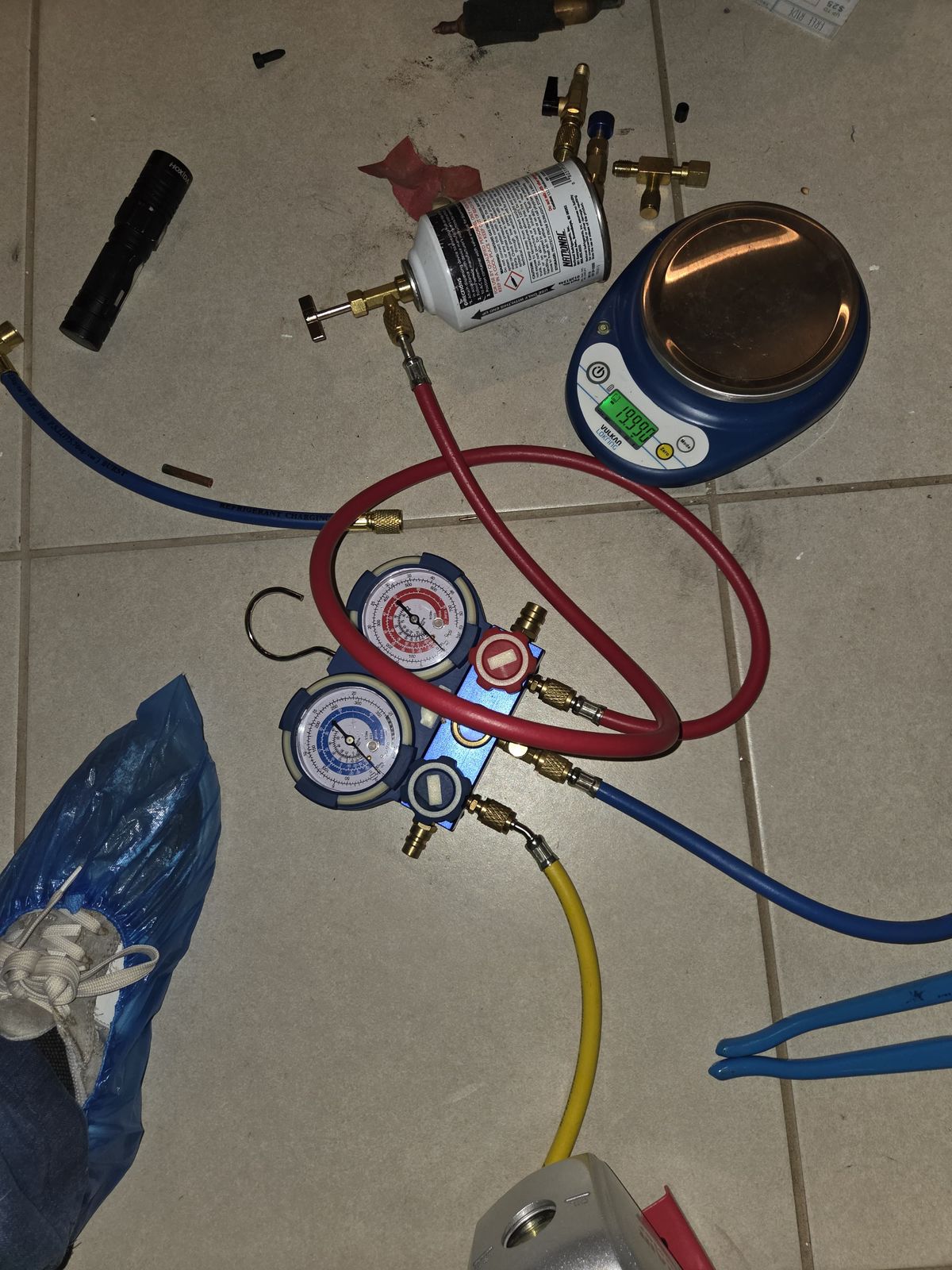 Refrigerant gauges and scale during an HVAC diagnostic