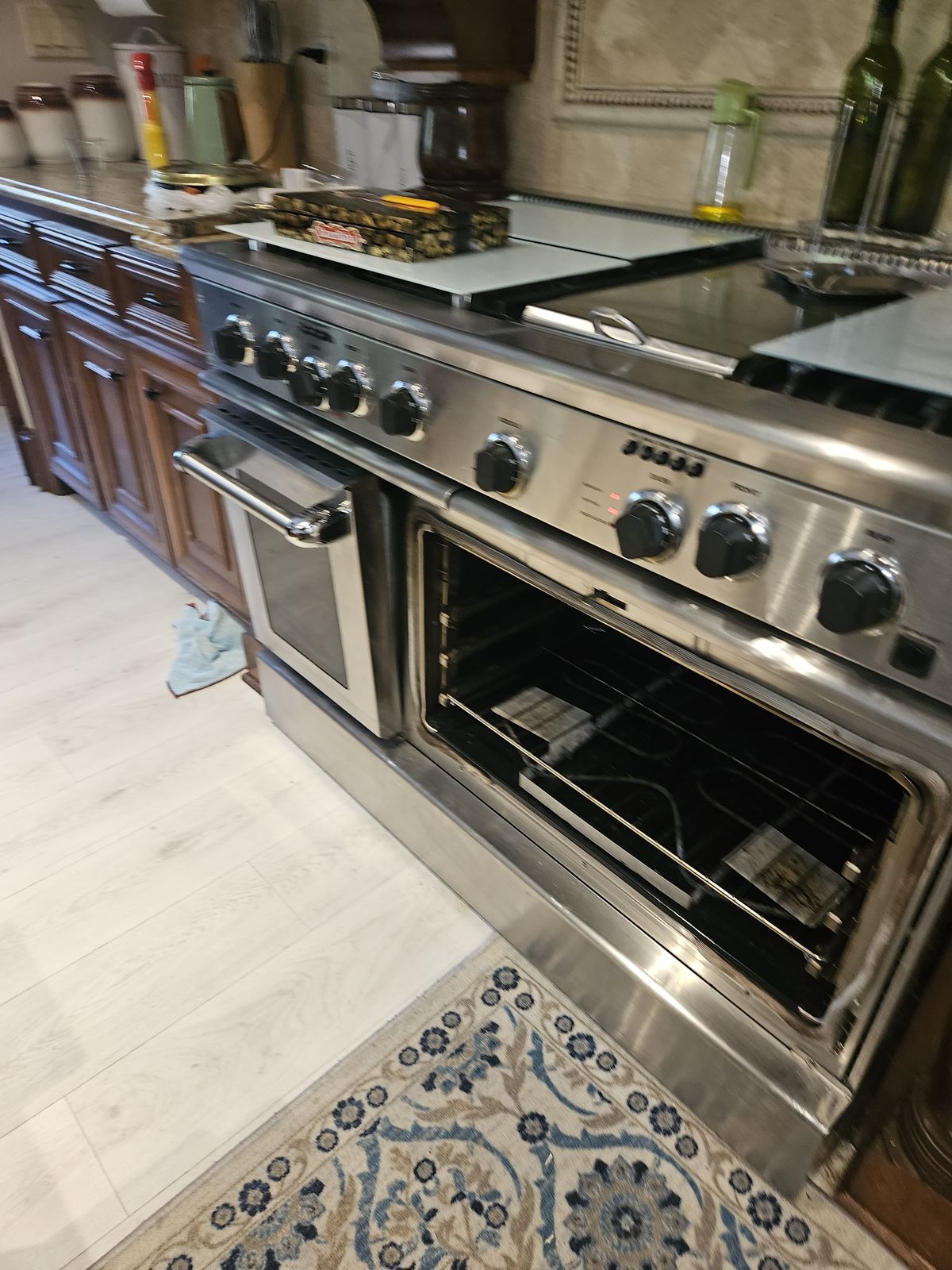 Professional-style range and double oven serviced in a kitchen
