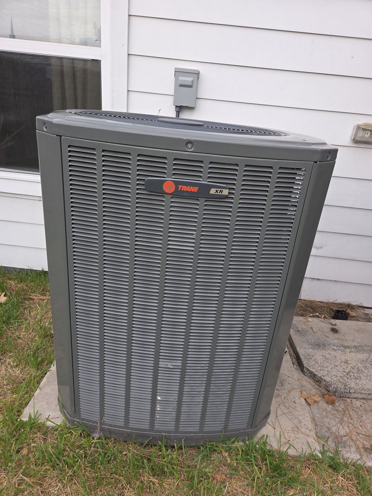 Outdoor AC condenser unit after service