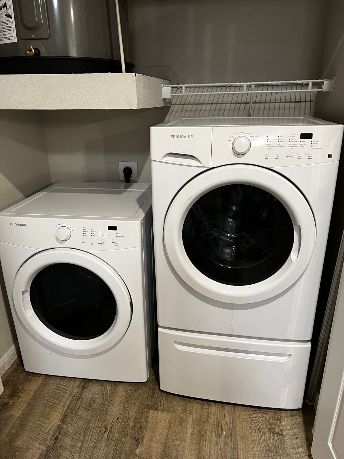 Washer and dryer pair in a laundry closet after repair